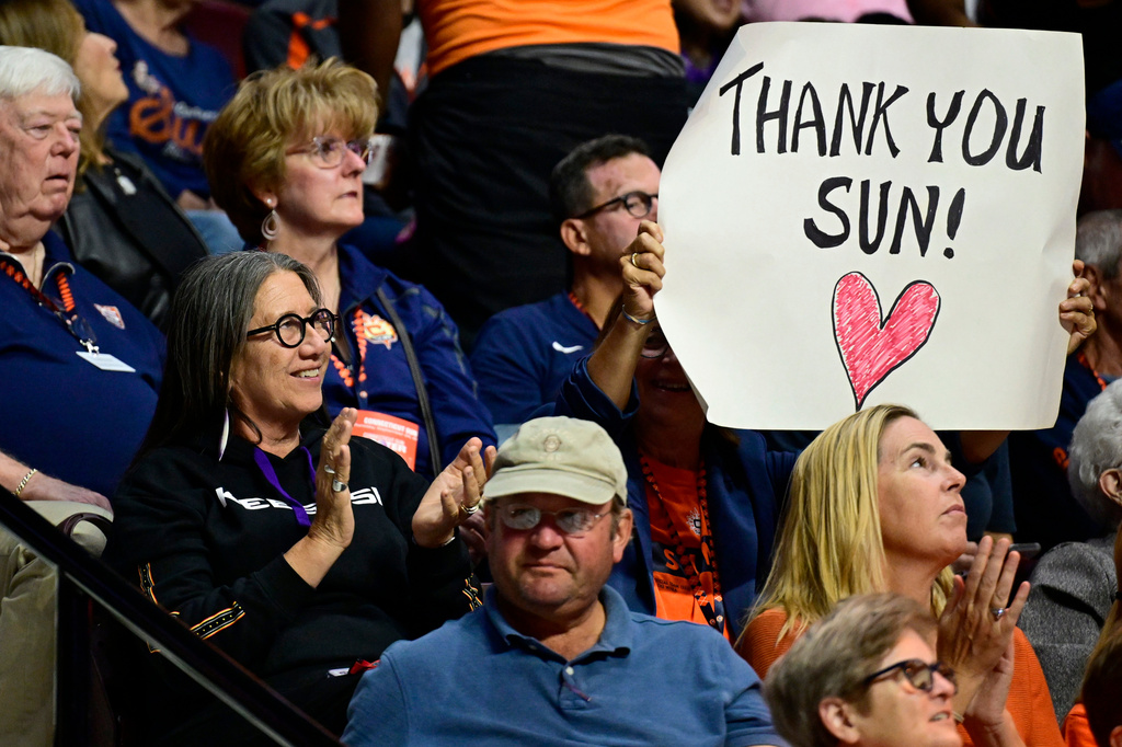 Beth Regan, left center, chairwoman of the Mohegan Tribe's Council of Elders, watches the last WNBA home game of the Connecticut Sun, against the Toronto Tempo, Thursday, Sept. 24, 2026, at Mohegan Sun in Uncasville, Conn. (AP Photo/Jessica Hill)