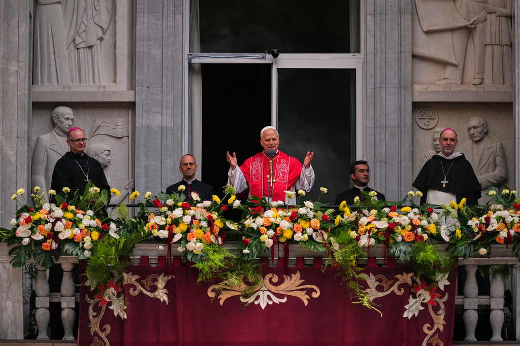 Pope Leo XIV greets the faithful from the balcony after leading a rosary at the Abbey of Our Lady of Montserrat, in Montserrat, Spain, Wednesday, June 10, 2026. (AP Photo/Joan Mateu Parra)