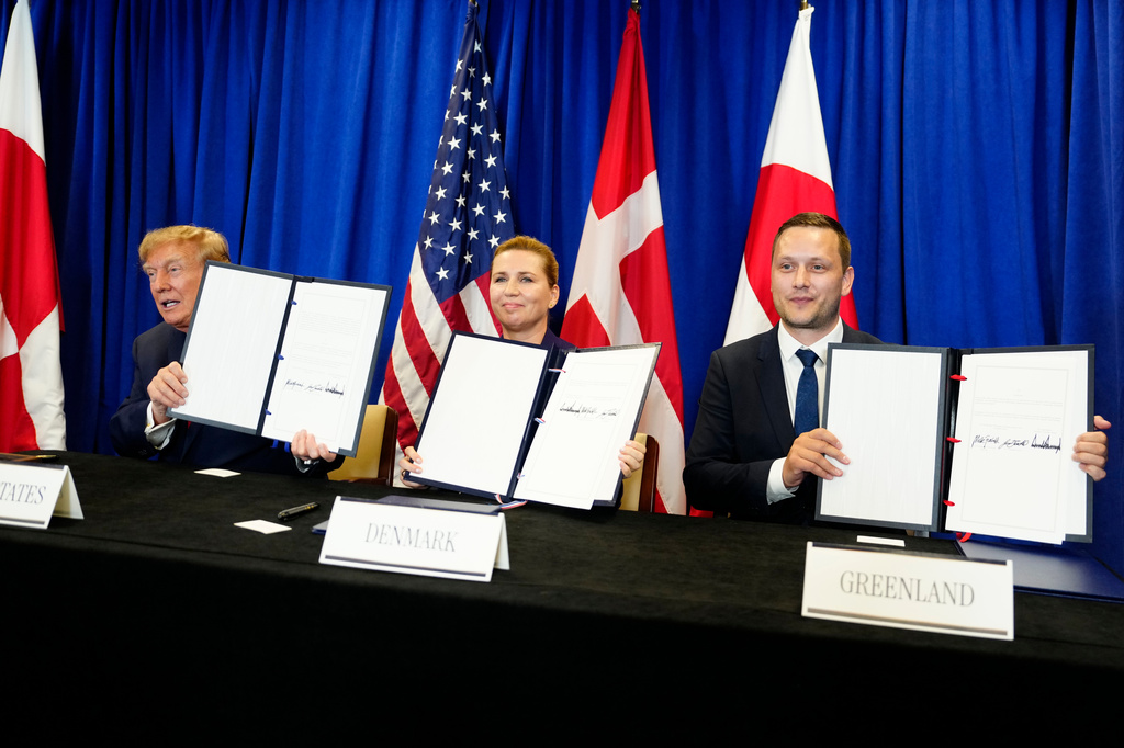 Denmark's Prime Minister Mette Frederiksen, center, Greenland's Prime Minister Jens-Frederik Nielsen, right, and US President Donald Trump at the signing ceremony of a security deal between the U.S., Denmark and Greenland at United Nations headquarters, Tuesday, Sept. 22, 2026. (Mads Claus Rasmussen/Ritzau Scanpix via AP)