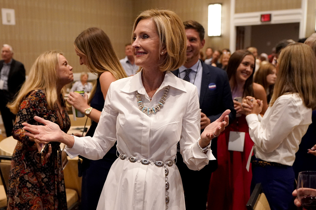 FILE - Republican Arizona Gubernatorial candidate Karrin Taylor Robson greets supporters at a campaign party, Aug. 2, 2022, in Phoenix. (AP Photo/Matt York, File)