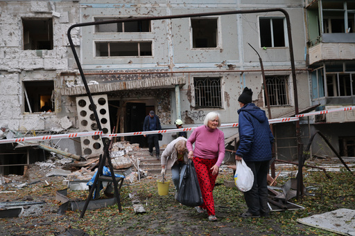Residents take their belongings from their house destroyed by a Russian strike in Zaporizhzhia, Ukraine, Sunday, Oct. 5, 2025. (AP Photo/Kateryna Klochko) Residents take their belongings from their house destroyed by a Russian strike in Zaporizhzhia, Ukraine, Sunday, Oct. 5, 2025. (AP Photo/Kateryna Klochko)