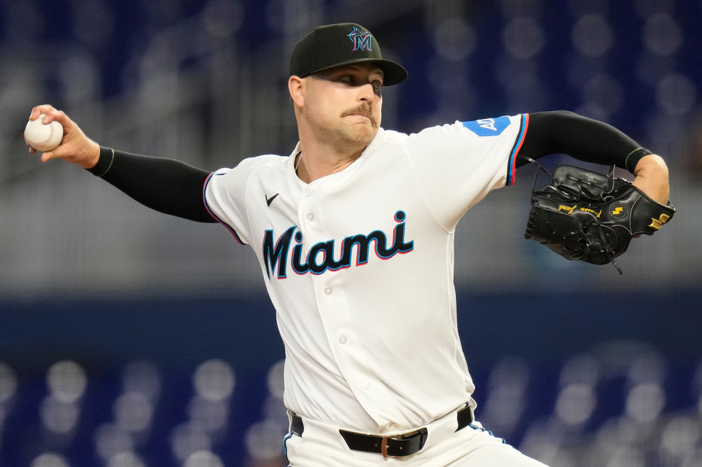 Miami Marlins starting pitcher Janson Junk throws during the first inning of a baseball game against the Seattle Mariners, Thursday, July 9, 2026, in Miami. (AP Photo/Lynne Sladky)