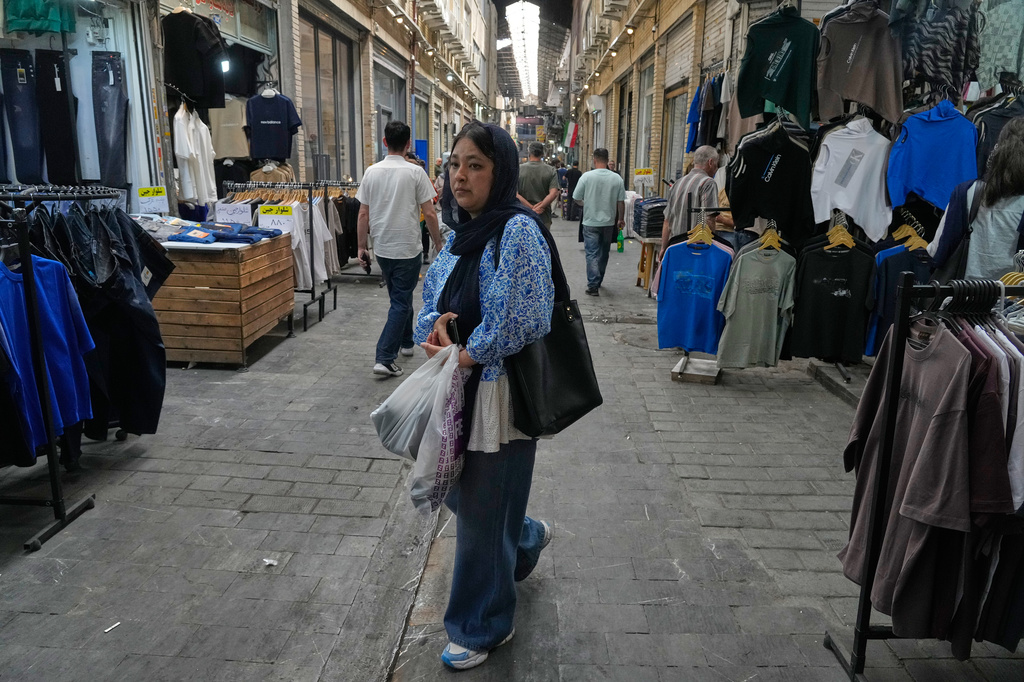 A woman walks at Tehran's historic Grand Bazaar, Iran, Monday, June 1, 2026. (AP Photo/Vahid Salemi)