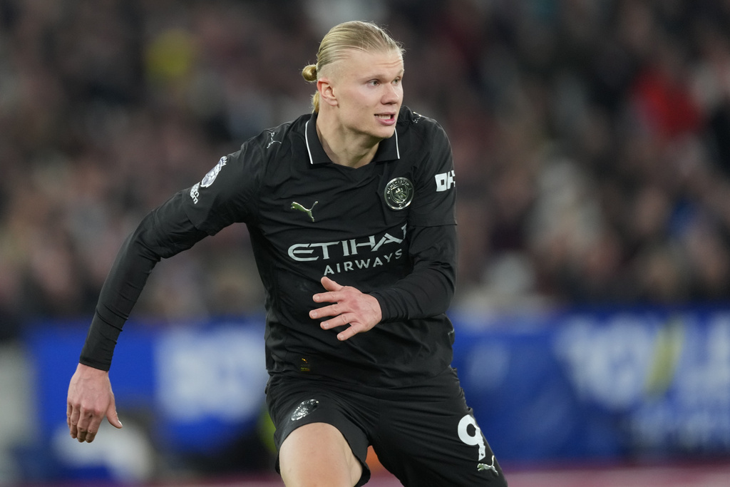 Manchester City's Erling Haaland runs for the ball during the English Premier League soccer match between West Ham United and Manchester City in London, England, Saturday, March 14, 2026. (AP Photo/Dave Shopland)
