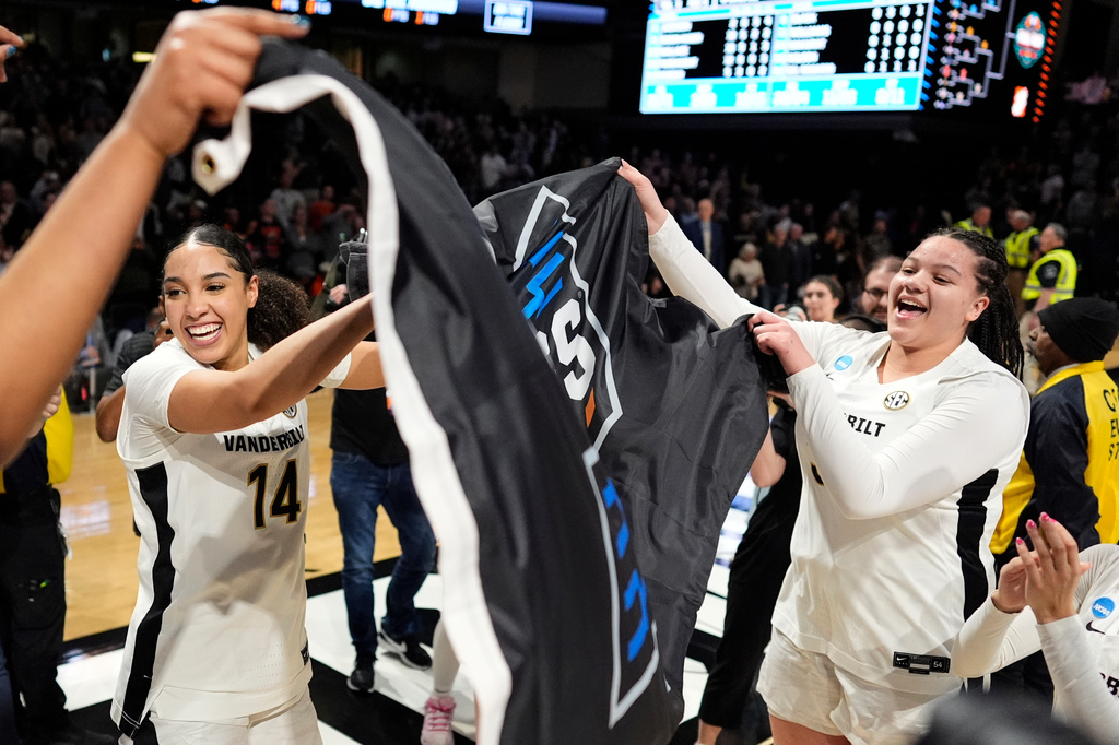 Vanderbilt forward Aiyana Mitchell (14) celebrates with forward Trinity Wilson, right, after the team's win against Illinois in the second round of the NCAA college basketball tournament Monday, March 23, 2026, in Nashville, Tenn. (AP Photo/George Walker IV)