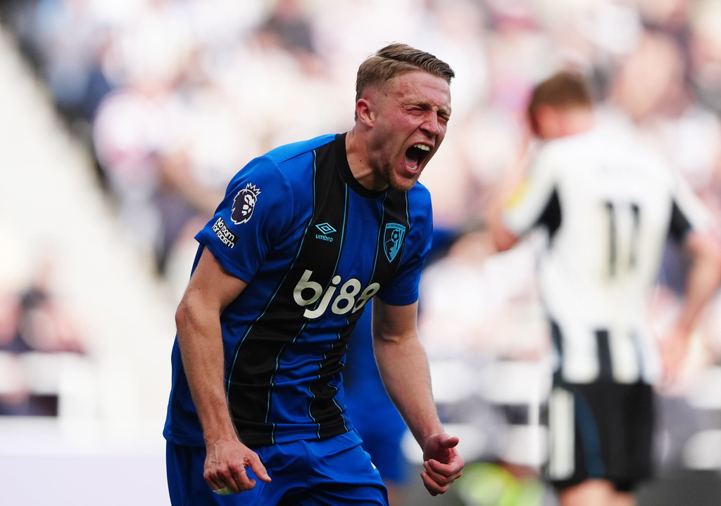 Bournemouth's Adrien Truffert celebrates scoring their side's second goal of the game during the English Premier League soccer match between Newcastle United and AFC Bournemouth, Saturday, April 18, 2026, in Newcastle, England. (Owen Humphreys/PA via AP)