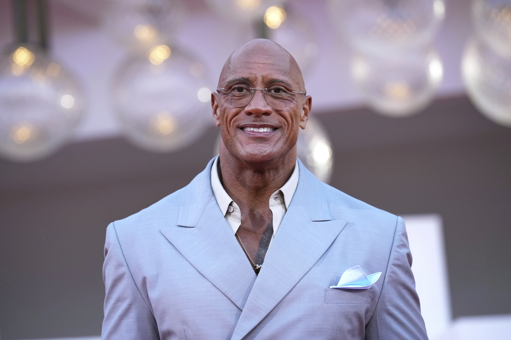 Dwayne Johnson poses for photographers on the red carpet for the film 'The Smashing Machine' during the 82nd edition of the Venice Film Festival in Venice, Italy, on Monday, Sept. 1, 2025. (Photo by Alessandra Tarantino/Invision/AP)