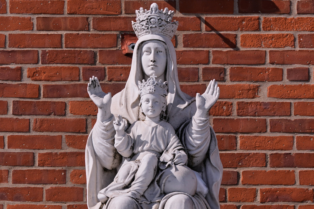 A statue of the Virgin Mary and baby Jesus is displayed outside St. Mary's Church, Tuesday, Feb. 24, 2026, in Cranston, R.I. (AP Photo/Charles Krupa)