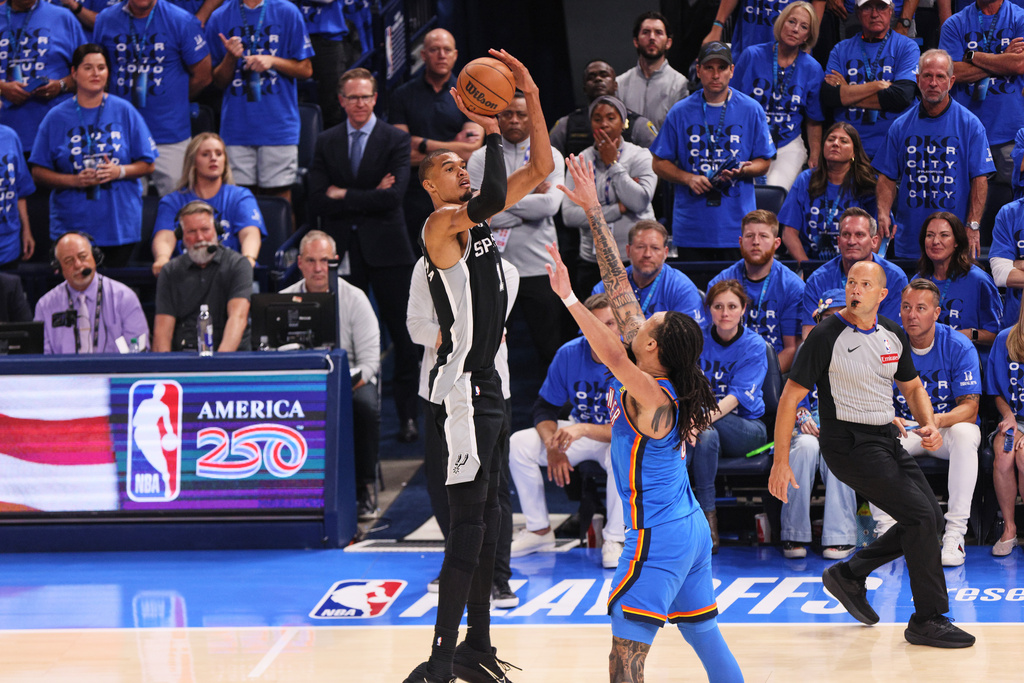 San Antonio Spurs forward Victor Wembanyama (1) shoots against Oklahoma City Thunder forward Jaylin Williams (6) in the second half of Game 7 of the Western Conference finals of the NBA basketball playoffs series Saturday, May 30, 2026, in Oklahoma City. (AP Photo/Nate Billings)