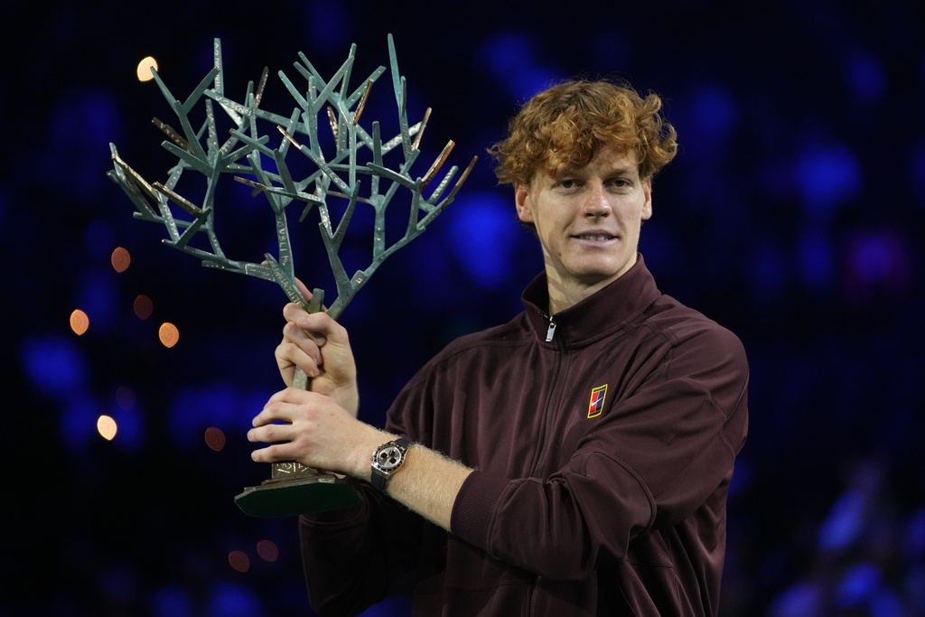 Italy's Jannik Sinner holds the trophy after winning the final match of the Paris Masters tennis tournament against Canada's Felix Auger-Aliassime in Paris, Sunday, Nov. 2, 2025. (AP Photo/Christophe Ena)