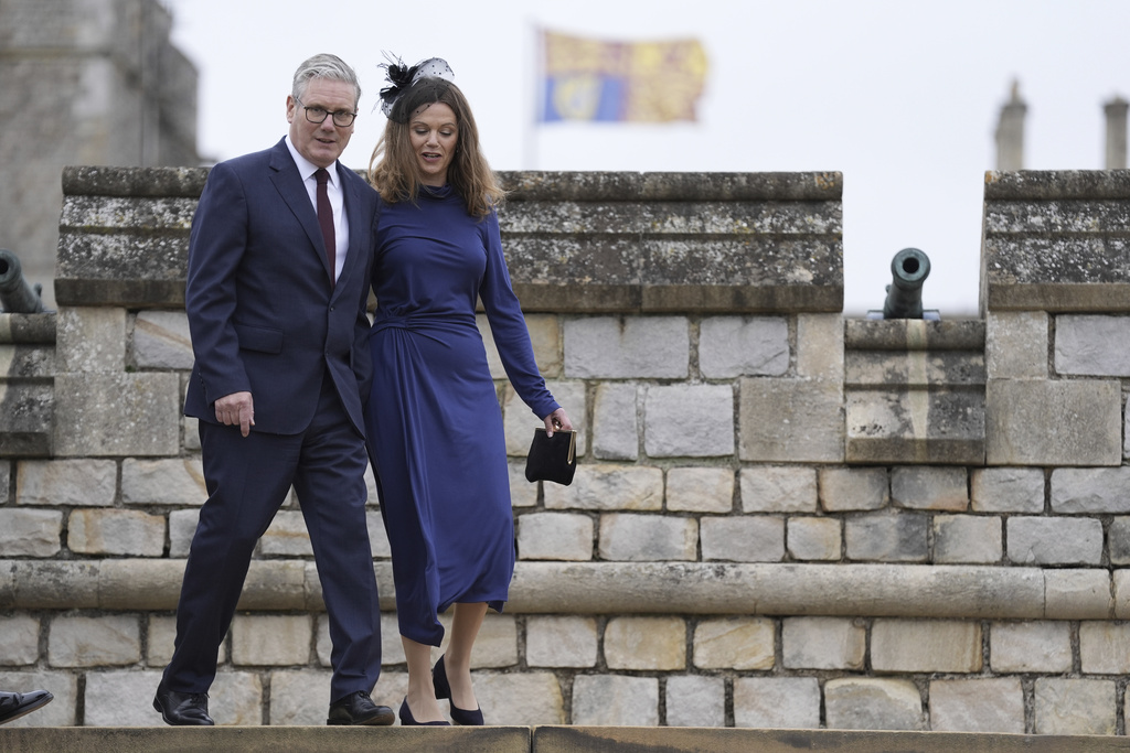 British Prime Minister Sir Keir Starmer and wife, Lady Victoria Starmer, arrive for the Beating Retreat military ceremony at Windsor Castle, England, on Wednesday Sept. 17, 2025, day one of the president's second state visit to the UK. (Andrew Matthews/PA via AP, Pool)