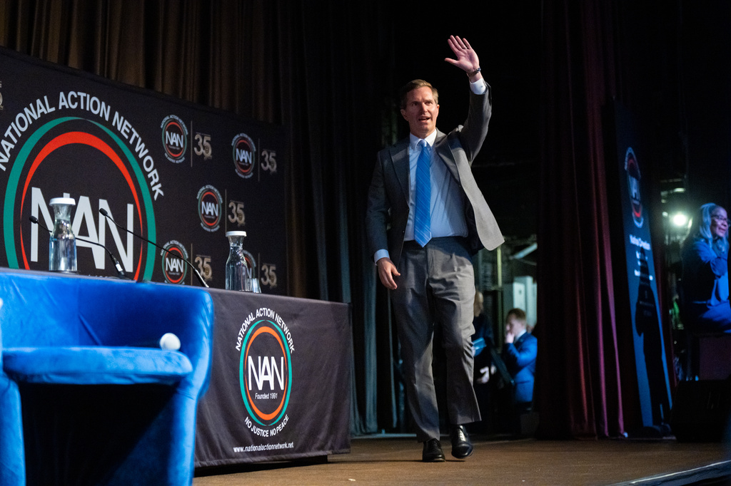 Kentucky Gov. Andy Beshear waves to the audience as he arrives onstage at the National Action Network (NAN) Convention in New York, Saturday, April 11, 2026. (AP Photo/Angelina Katsanis)