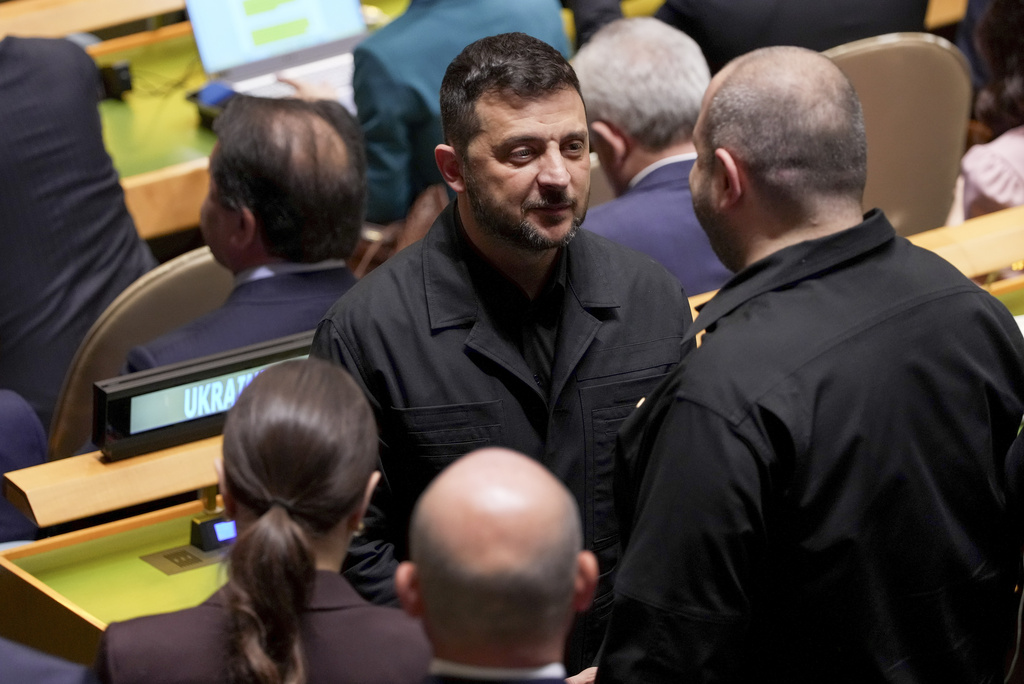 Ukraine President Volodymyr Zelenskyy greets delegates to the 80th session of the United Nations General Assembly, Tuesday, Sept. 23, 2025, at UN headquarters. (AP Photo/Angelina Katsanis)