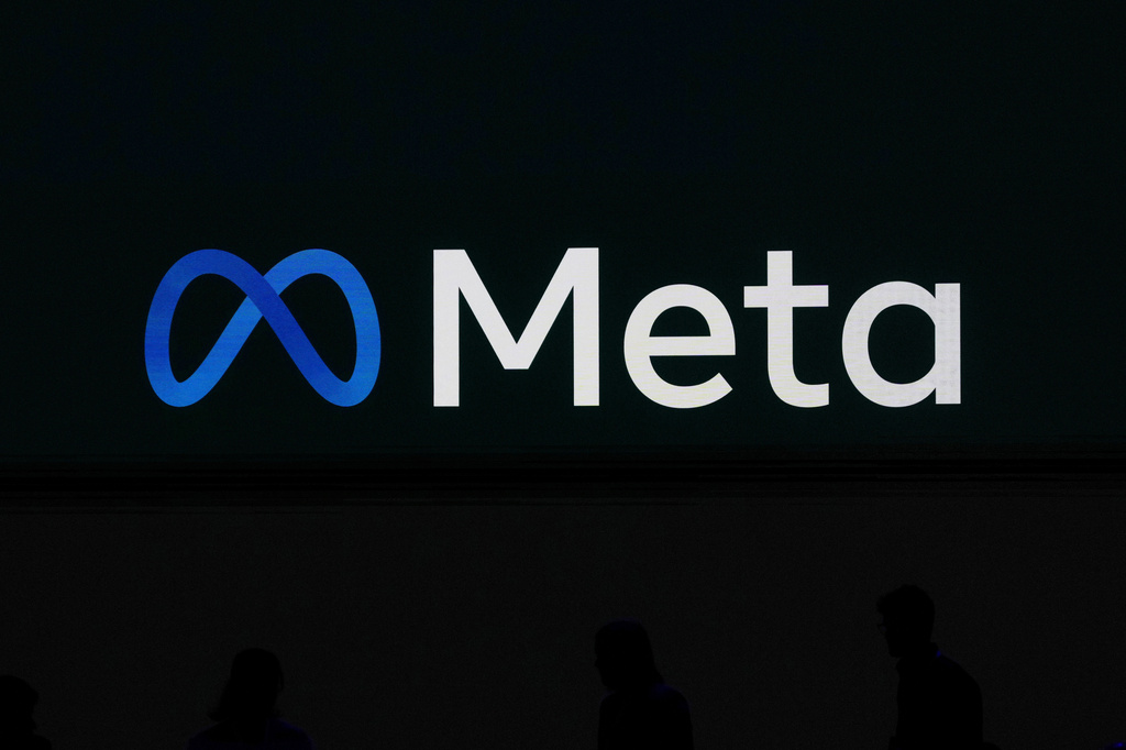 FILE - A Meta logo is shown on a video screen at LlamaCon 2025, an AI developer conference, in Menlo Park, Calif., April 29, 2025. (AP Photo/Jeff Chiu, File)