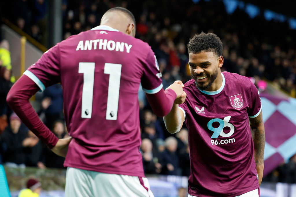 Burnley's Lyle Foster, right, celebrates with teammate Jaidon Anthony after scoring his side's second goal of the game, during the English Premier League soccer match between Burnley and Tottenham Hotspur, at Turf Moor, in Burnley, England, Saturday, Jan. 24, 2026. (Richard Sellers/PA via AP)