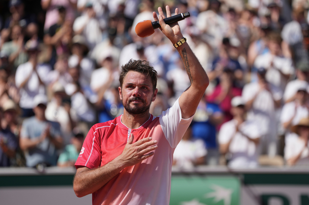 Stan Wawrinka of Switzerland reacts after the first round men's singles tennis match against Jesper De Jong of the Netherlands at the French Open tennis tournament in Paris, Monday, May 25, 2026. (AP Photo/Thibault Camus)