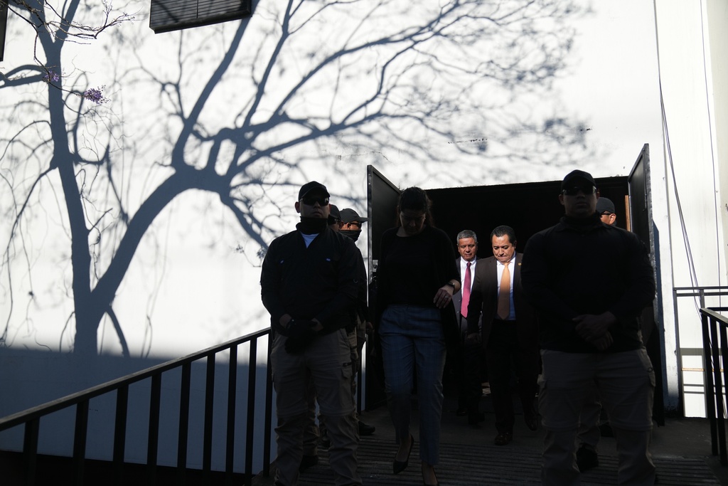 Lawyers leave after voting in an election of magistrates to represent the bar association on the Constitutional Court in Guatemala City, Thursday, Feb. 12, 2026. (AP Photo/Moises Castillo)