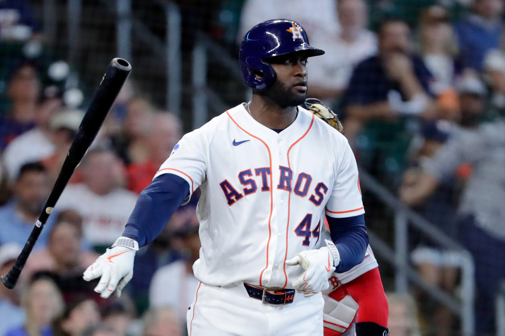 Houston Astros designated hitter Yordan Alvarez tosses his bat after being hit by a pitch as he stares down Boston Red Sox starting pitcher Garrett Crochet during the fifth inning of a baseball game Wednesday, April 1, 2026, in Houston. (AP Photo/Michael Wyke)