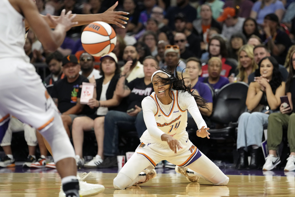 Phoenix Mercury forward DeWanna Bonner (14) passes the ball against the Chicago Sky during the second half of a WNBA basketball game Thursday, Aug. 28, 2025, in Phoenix. (AP Photo/Ross D. Franklin)