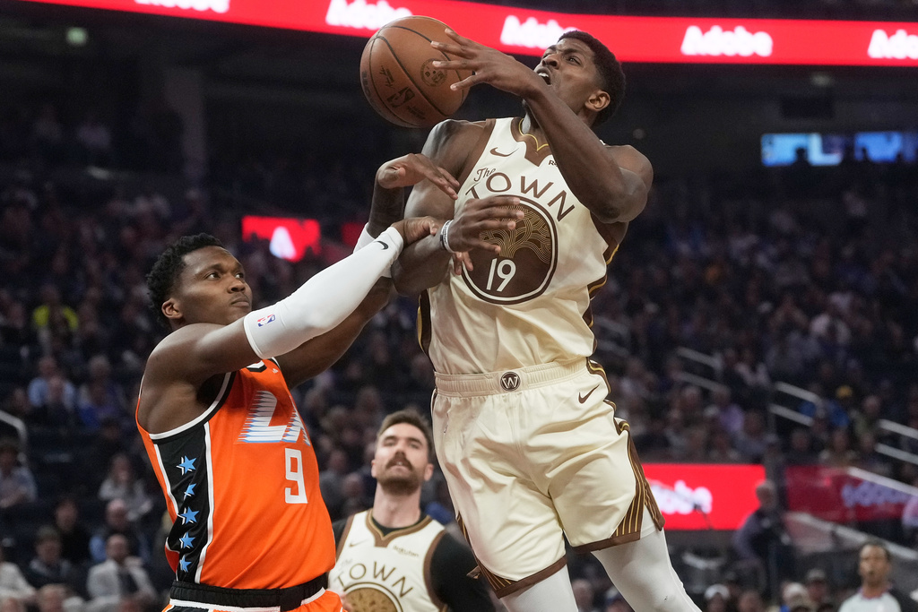 Golden State Warriors guard Nate Williams (19) loses the ball while being defended by Los Angeles Clippers guard Bennedict Mathurin (9) during the first half of an NBA basketball game in San Francisco, Monday, March 2, 2026. (AP Photo/Jeff Chiu)