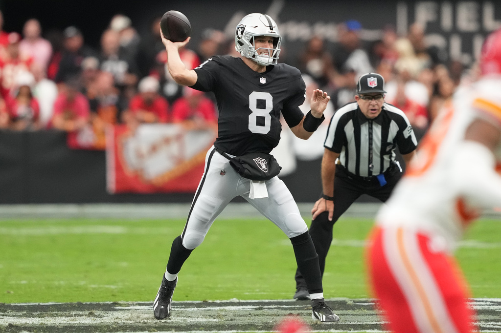 Las Vegas Raiders quarterback Kirk Cousins (8) looks to pass during the first half of an NFL football game against the Kansas City Chiefs in Las Vegas, Sunday, Oct. 4, 2026. (AP Photo/Rick Scuteri)