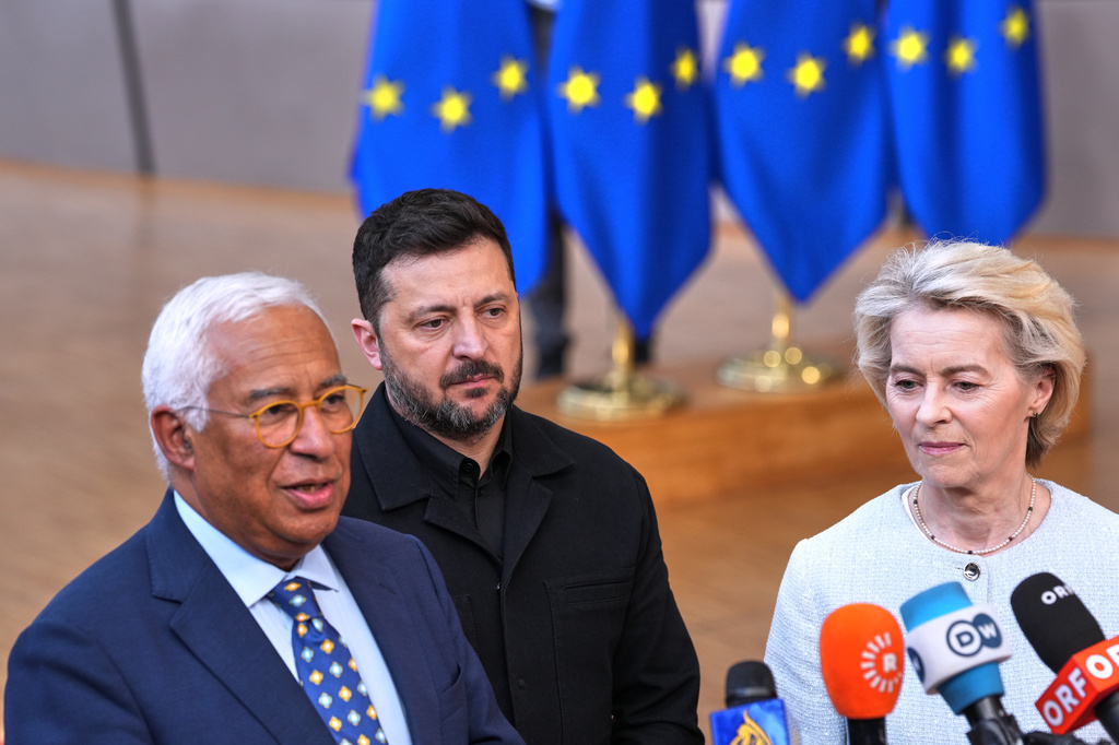 From left, European Council President Antonio Costa, Ukraine's President Volodymyr Zelenskyy and European Commission President Ursula von der Leyen talk to journalists as they arrive for the EU summit in Brussels, Thursday, June 18, 2026. (AP Photo/Marius Burgelman)