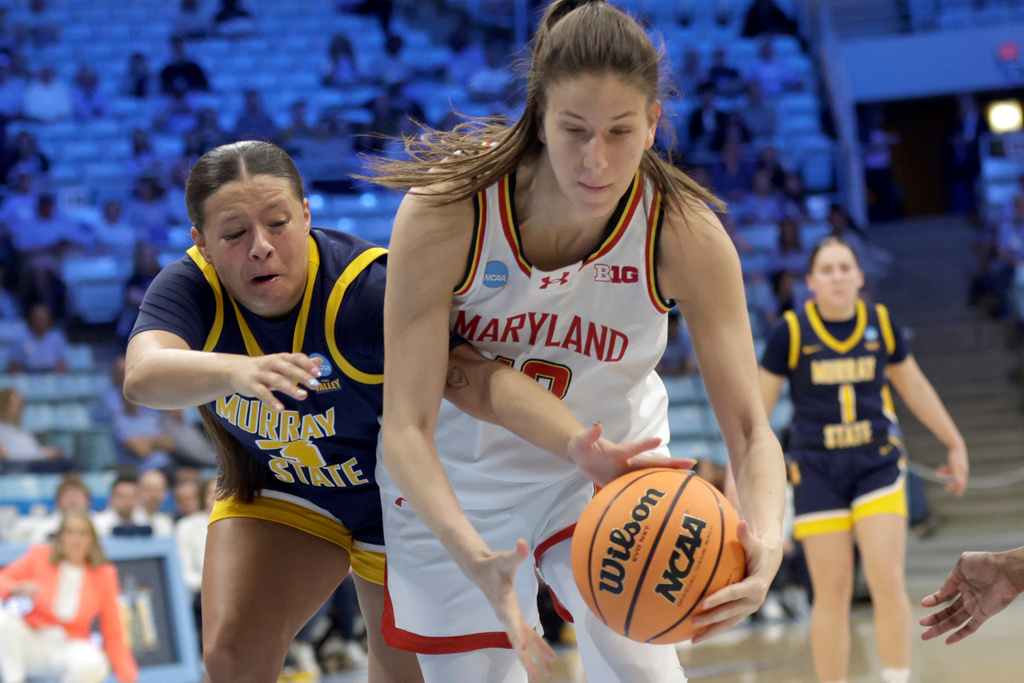 Murray State guard Briley Pena, left, and Maryland guard Yarden Garzon, right, battle for control of the ball during the second half in the first round of the NCAA college basketball tournament, Friday, March 20, 2026, in Chapel Hill, N.C. (AP Photo/Chris Seward)