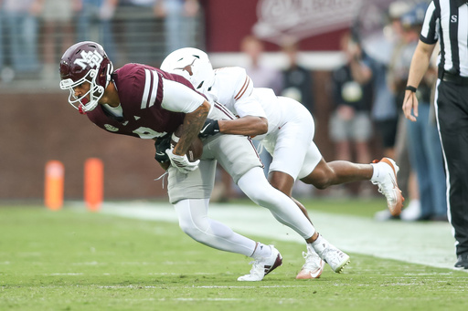 Mississippi State tight end Seydou Traore, left, is tackled by Texas defensive back Malik Muhammad, second from left, during the first half of an NCAA college football game in Starkville, Miss., Saturday, Oct. 25, 2025. (AP Photo/James Pugh) Mississippi State tight end Seydou Traore, left, is tackled by Texas defensive back Malik Muhammad, second from left, during the first half of an NCAA college football game in Starkville, Miss., Saturday, Oct. 25, 2025. (AP Photo/James Pugh)