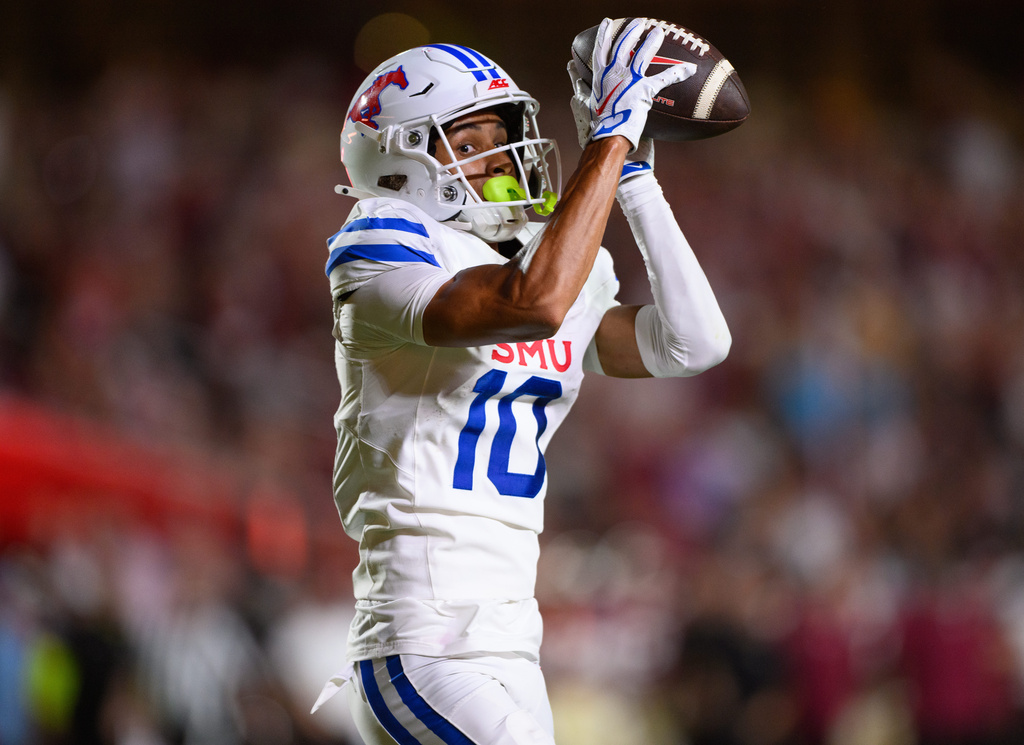 SMU wide receiver Jalen Cooper catches a touchdown pass during the first half of an NCAA college football game against Florida State, Monday, Sept. 7, 2026, in Tallahassee, Fla. (AP Photo/Noah Lantor)