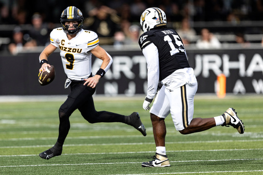 Missouri quarterback Beau Pribula (9) looks for a receiver as he's chased by Vanderbilt defensive lineman Zaylin Wood (15) during the first half of an NCAA college football game, Saturday, Oct. 25, 2025, in Nashville, Tenn. (AP Photo/Wade Payne) Missouri quarterback Beau Pribula (9) looks for a receiver as he's chased by Vanderbilt defensive lineman Zaylin Wood (15) during the first half of an NCAA college football game, Saturday, Oct. 25, 2025, in Nashville, Tenn. (AP Photo/Wade Payne)