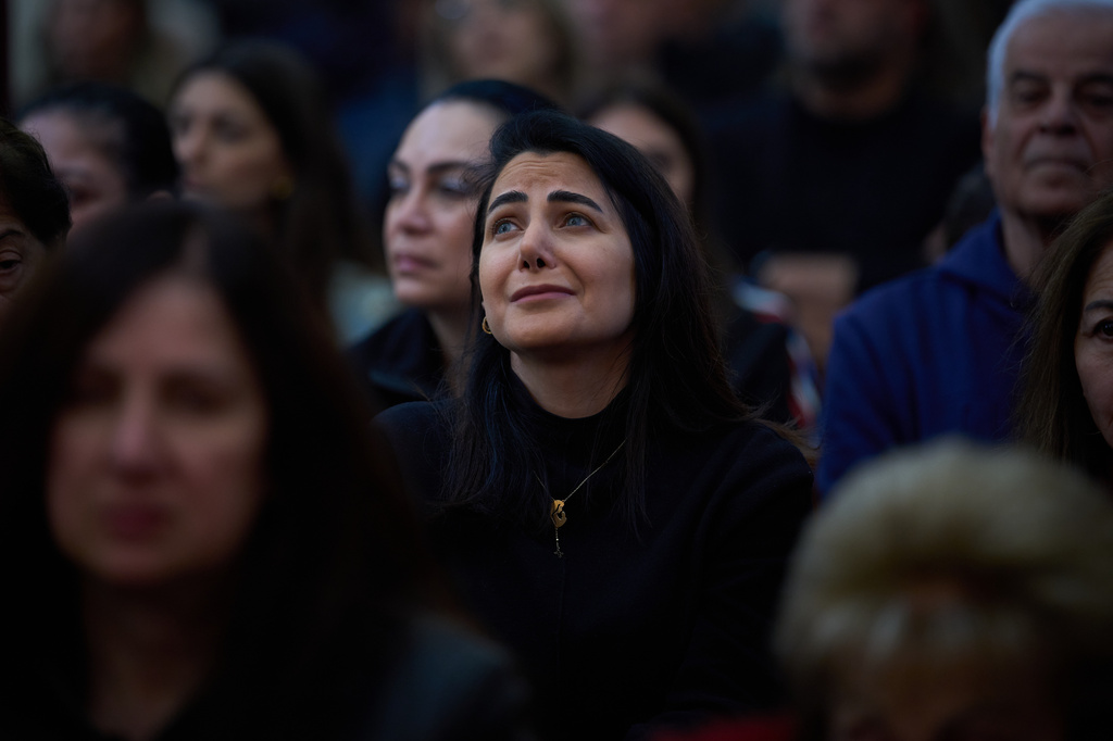 Worshipers pray during Good Friday Mass at St. Anthony Church, which was devoted to expressing solidarity with Christian villagers in southern Lebanon displaced by the war in Jdeideh, a suburb of Beirut, Lebanon, Friday, April 3, 2026. (AP Photo/Emilio Morenatti)