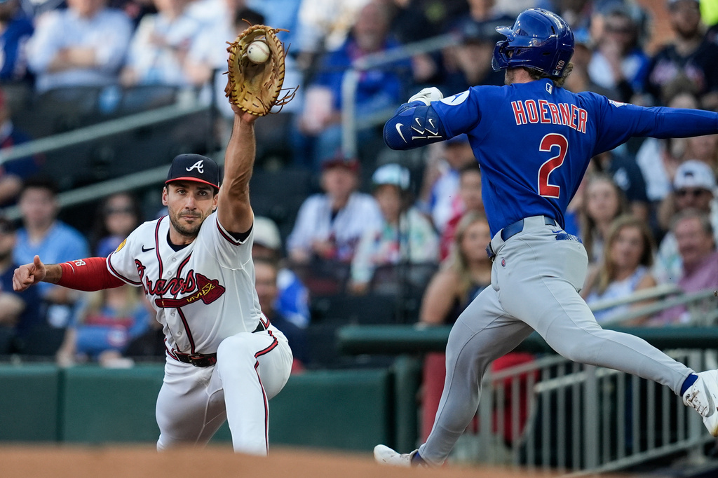 Atlanta Braves first baseman Matt Olson (28) makes the catch against Chicago Cubs' Nico Hoerner (2) in the first inning of a baseball game, Tuesday, May 12, 2026, in Atlanta. (AP Photo/Mike Stewart)