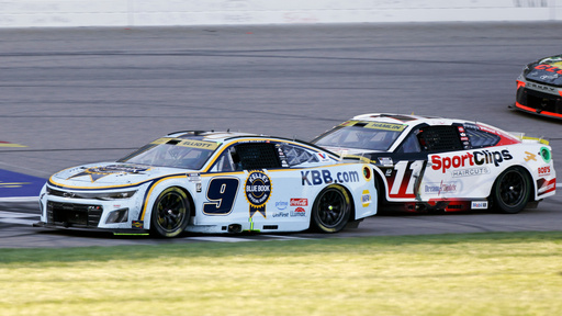 Chase Elliott (9) crosses the finish line to win a NASCAR Cup Series auto race as Denny Hamlin (11) comes in second at Kansas Speedway in Kansas City, Kan., Sunday, Sept. 28, 2025. (AP Photo/Colin E. Braley) Chase Elliott (9) crosses the finish line to win a NASCAR Cup Series auto race as Denny Hamlin (11) comes in second at Kansas Speedway in Kansas City, Kan., Sunday, Sept. 28, 2025. (AP Photo/Colin E. Braley)