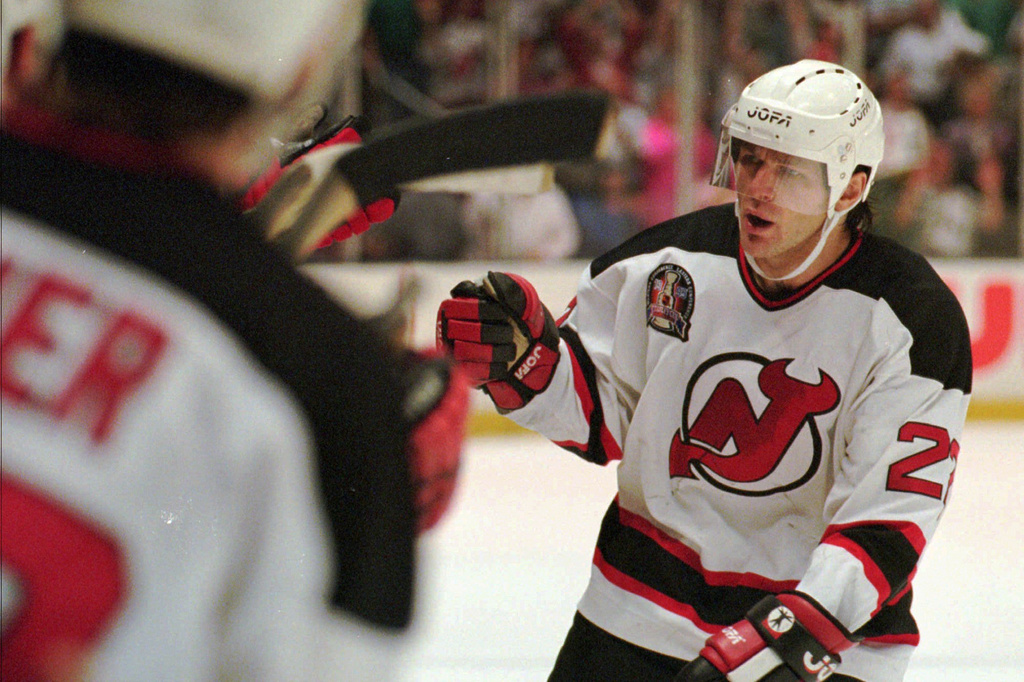 FILE - New Jersey Devils Claude Lemieux is greeted at the bench after scoring a goal in the first period of Game 3 of the NHL Stanley Cup Finals against the Detroit Redwings Thursday, June 22, 1995 at the Meadowlands in East Rutherford, N.J. (AP Photo/Bill Kostroun , File)