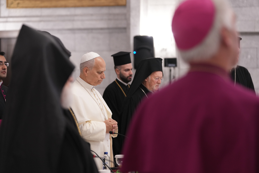 Pope Leo XIV, center, prays during a meeting with the leaders of the local churches and Christian communities at the Syriac Orthodox Church of Mor Ephrem in Istanbul, Turkey, Saturday, Nov. 29, 2025. (AP Photo/Domenico Stinellis)
