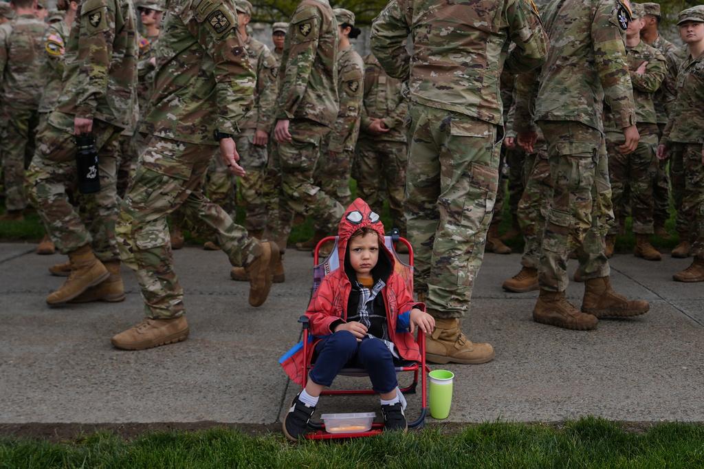 Brixten Hennon, 2, watches cadets compete in the crucible portion of the Sandhurst Military Skills Competition at the United States Military Academy in West Point, N.Y., Saturday, May 2, 2026. (AP Photo/Julia Demaree Nikhinson)