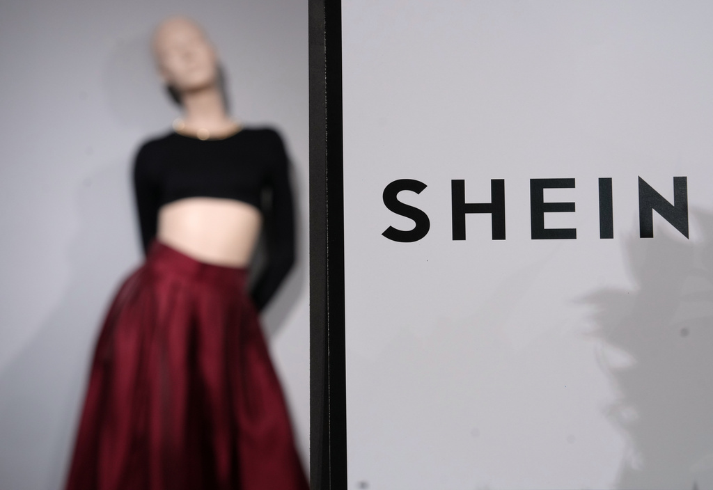 FILE - Clothes by Chinese company Shein are seen in the BHV (Bazar de l'Hotel de Ville) department store, Tuesday, Nov. 4, 2025 in Paris. (AP Photo/Aurelien Morissard, File)