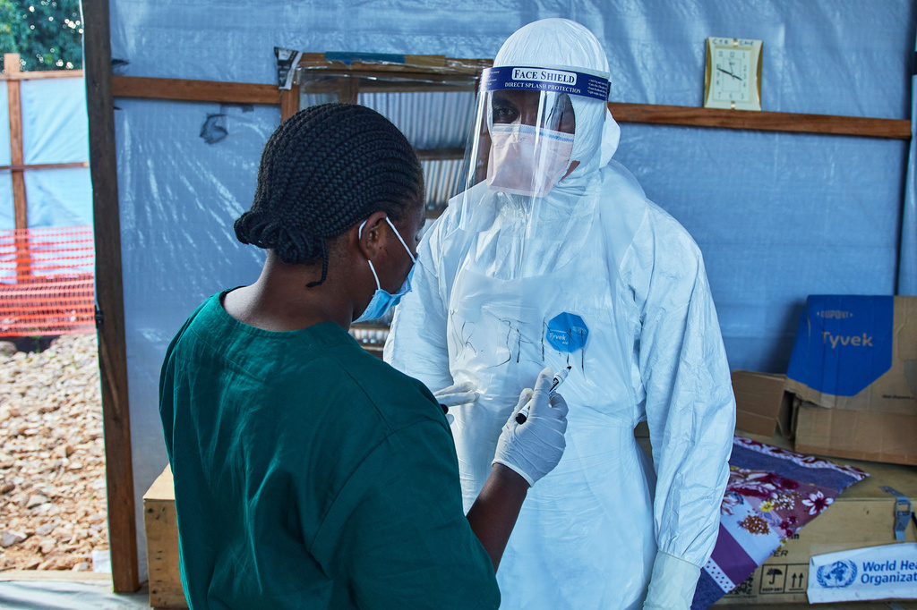 Health workers interact at the Evangelical Medical Center, in Bunia, eastern Congo, Friday, July 3, 2026, where Ebola clinical trials are scheduled to take place. (AP Photo/Dirole Lotsima Dieudonne)
