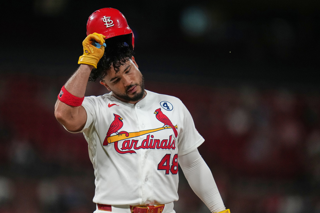 St. Louis Cardinals' Iván Herrera removes his helmet after grounding out to end the eighth inning of a baseball game against Texas Rangers Tuesday, June 2, 2026, in St. Louis. (AP Photo/Jeff Roberson)