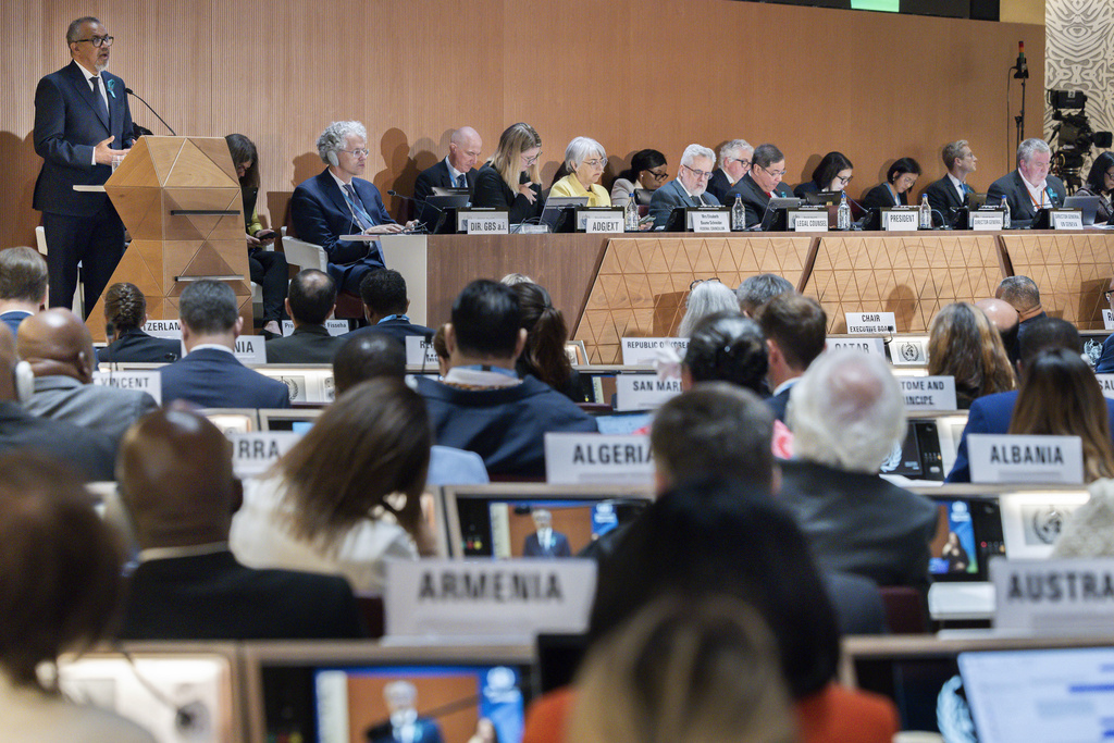 FILE - Director General of the World Health Organization (WHO) Tedros Adhanom Ghebreyesus, left, delivers his statement, during the opening of the 78th World Health Assembly at the European headquarters of the United Nations in Geneva, Switzerland, May 19, 2025. (Magali Girardin/Keystone via AP, File)