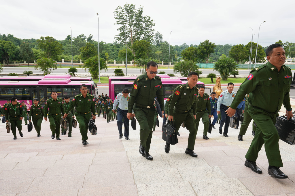 Myanmar's military representatives arrive to attend a regular session of the Union Parliament in Naypyitaw, Myanmar, Friday, July 31, 2026. (AP Photo/Aung Shine Oo)