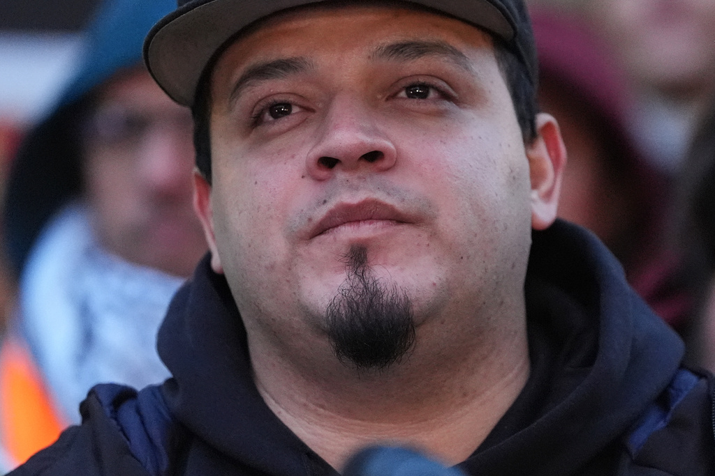 Kilmar Abrego Garcia listens during a rally ahead of a mandatory check at the Immigration and Customs Enforcement office in Baltimore, Friday, Dec. 12, 2025, after he was released from detention on Thursday under a judge's order. (AP Photo/Stephanie Scarbrough)