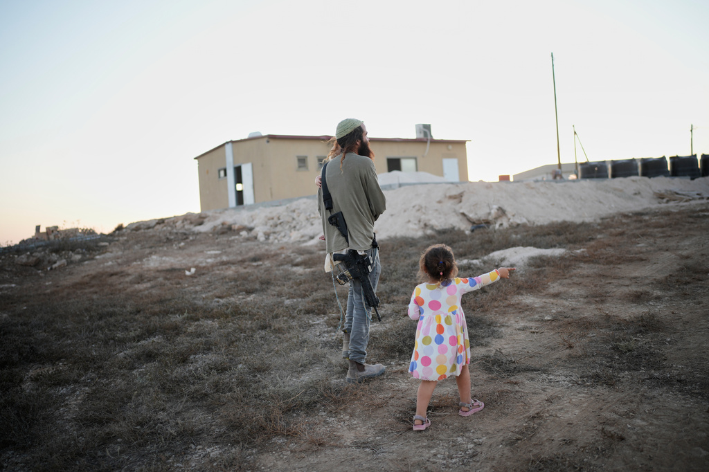 Israeli settlers gather to celebrate the inauguration of a newly built synagogue at the occupied West Bank outpost of Homesh, Wednesday, Sept. 16, 2026. (AP Photo/Ohad Zwigenberg)