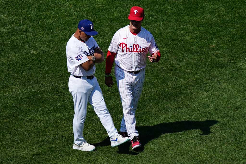 Philadelphia Phillies interim manager Don Mattingly, right, and Los Angeles Dodgers manager Dave Roberts speak during the MLB baseball All-Star Week, Monday, July 13, 2026, in Philadelphia. (AP Photo/Matt Slocum)