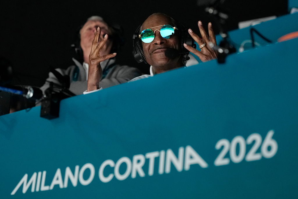 Snoop Dogg attends a men's ice hockey quarterfinal game between the United States and Sweden at the 2026 Winter Olympics, in Milan, Italy, Wednesday, Feb. 18, 2026. (AP Photo/Hassan Ammar)