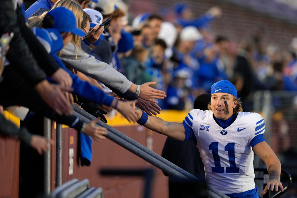 FILE - BYU wide receiver Parker Kingston (11) celebrates with fans after a win over Iowa State in an NCAA college football game, Oct. 25, 2025, in Ames, Iowa. (AP Photo/Matthew Putney, File)