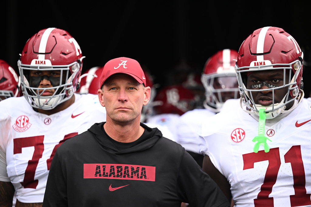FILE - Alabama head coach Kalen DeBoer leads his team onto the field before the Rose Bowl College Football Playoff quarterfinal game against Indiana, Jan. 1, 2026, in Pasadena, Calif. (AP Photo/Kyusung Gong, File)