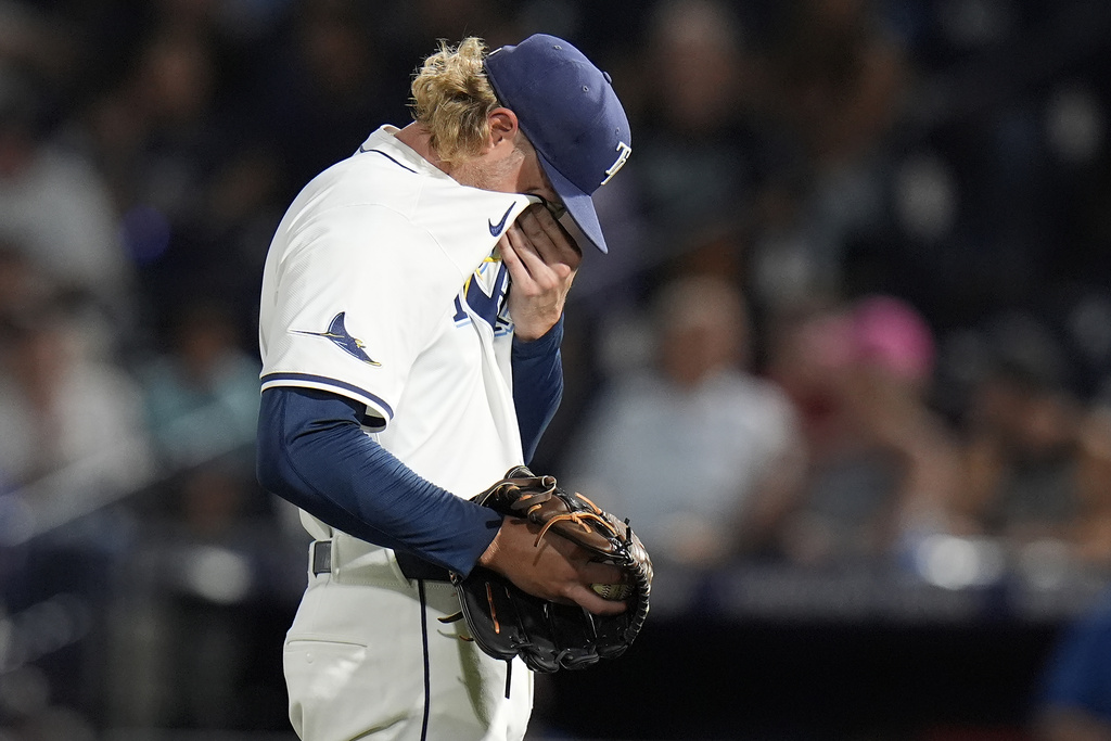 Tampa Bay Rays pitcher Shane Baz reacts after giving up three home runs to the New York Yankees during the first inning of a baseball game Tuesday, Aug. 19, 2025, in Tampa, Fla. (AP Photo/Chris O'Meara)