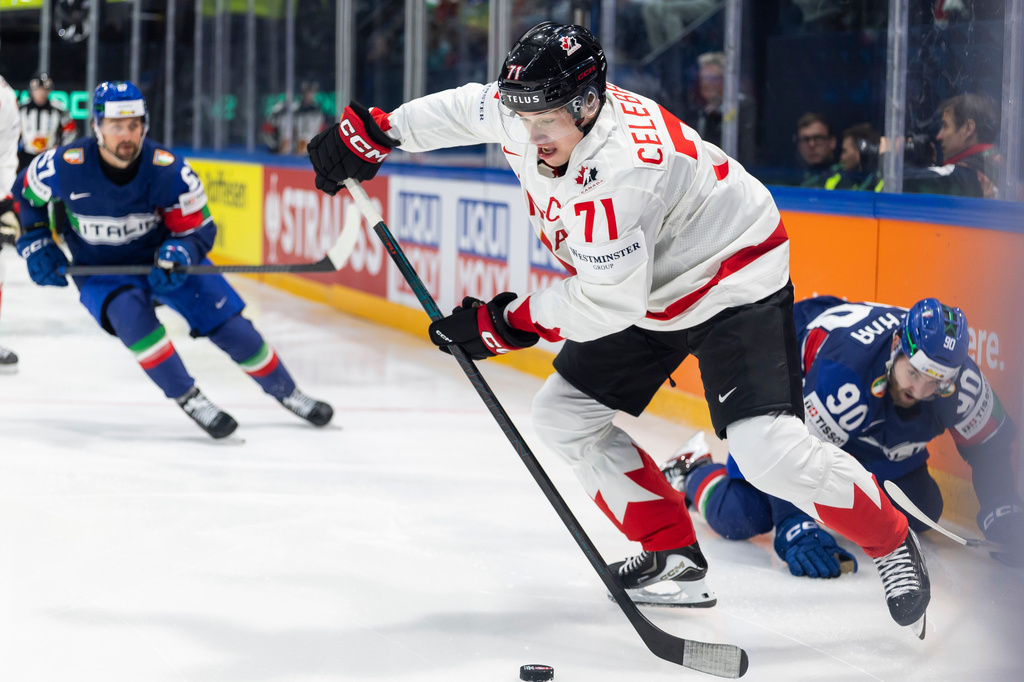 Canada's Macklin Celebrini in action, during the 2026 IIHF Men's Ice Hockey World Championship preliminary round group B game between Italy and Canada, in Fribourg, Switzerland, Saturday, May 16, 2026. (Cyril Zingaro/Keystone via AP)