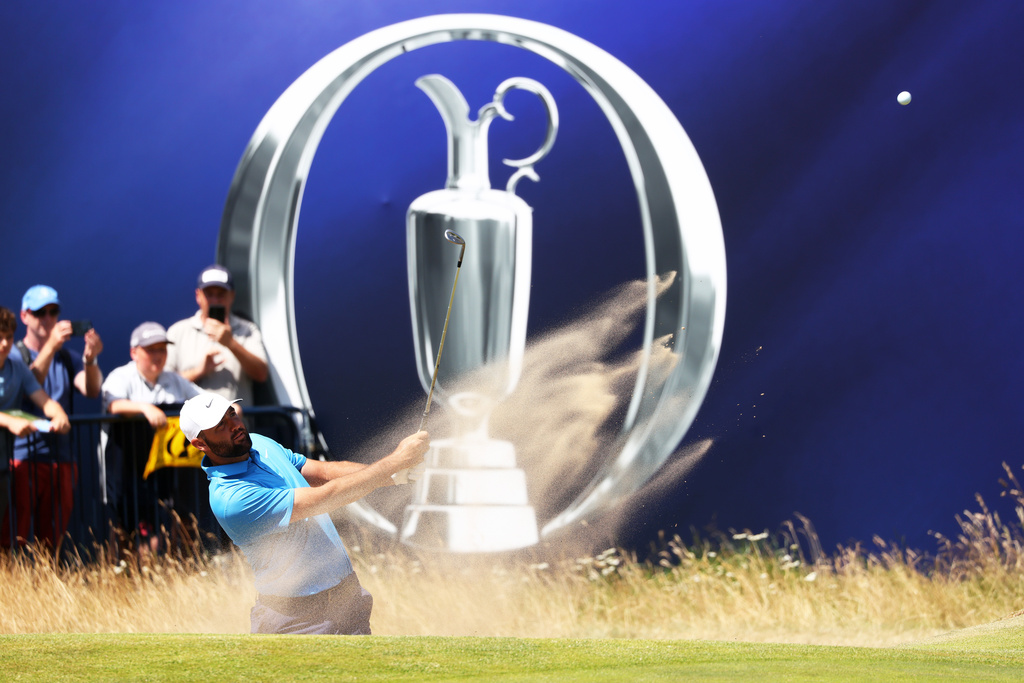 US golfer Scottie Scheffler plays out of the bunker during a practice round at the British Open Golf Championship at Royal Birkdale, Southport, England, Monday, July 13, 2026. (AP Photo/Peter Morrison)